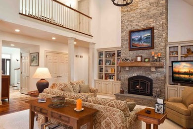 Inspiration for a large transitional open concept carpeted family room remodel in Other with white walls, a standard fireplace, a stone fireplace and a tv stand