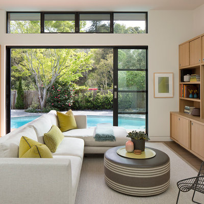 Inspiration for a mid-sized contemporary open concept family room remodel in San Francisco with white walls and a media wall