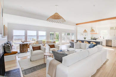 Large beach style open concept light wood floor family room photo in Other with white walls, a two-sided fireplace, a shiplap fireplace and a wall-mounted tv
