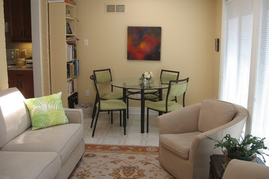 Example of a small transitional enclosed vinyl floor and white floor family room design in Toronto with beige walls, no fireplace and a tv stand