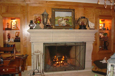Example of a large classic family room design in New York with blue walls and a standard fireplace