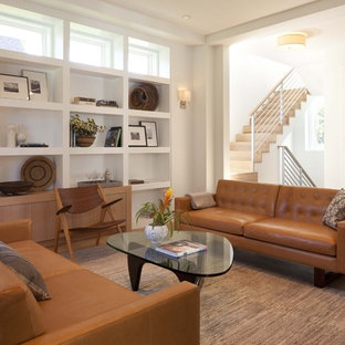 Inspiration for a modern medium tone wood floor family room remodel in Minneapolis with white walls