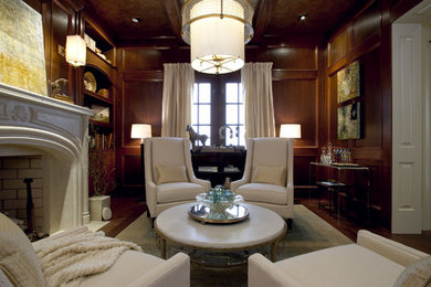 Пример оригинального дизайна: изолированная гостиная комната среднего размера в стиле неоклассика (современная классика) с с книжными шкафами и полками, паркетным полом среднего тона, стандартным камином и фасадом камина из камня без телевизора