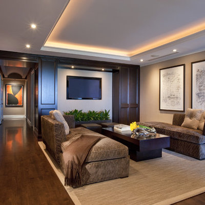 Inspiration for a contemporary dark wood floor family room remodel in Chicago with beige walls and a wall-mounted tv