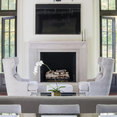Elegant open concept dark wood floor family room photo in DC Metro with white walls, a standard fireplace, a stone fireplace and a wall-mounted tv