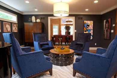 Mid-sized eclectic enclosed medium tone wood floor family room photo in New York with black walls