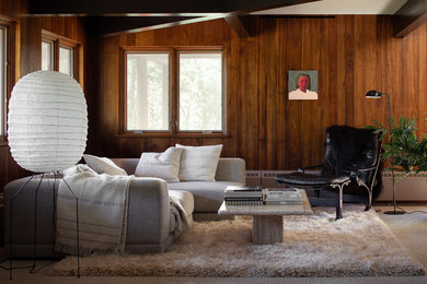 Modelo de sala de estar retro con paredes marrones, moqueta y suelo gris