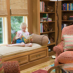 Example of a large classic enclosed dark wood floor and brown floor family room library design in DC Metro with beige walls, a standard fireplace and a stone fireplace
