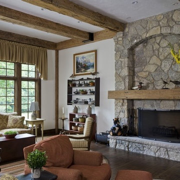 Living Room Featuring Wilsey Bay Stone Fireplace Surround and Reclaimed Beams