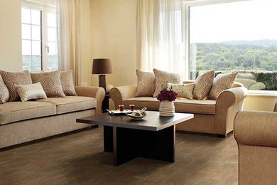 Example of a mid-sized classic open concept dark wood floor family room design in Other with beige walls