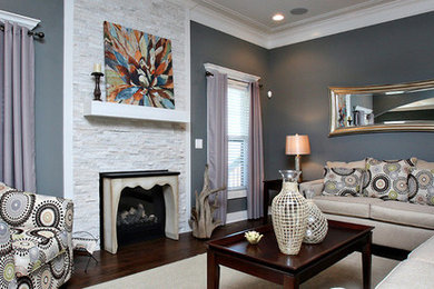 Family room - large transitional open concept dark wood floor family room idea in Louisville with gray walls, a standard fireplace and a stone fireplace