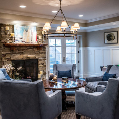 Inspiration for a timeless family room remodel in New York with a standard fireplace and a stone fireplace
