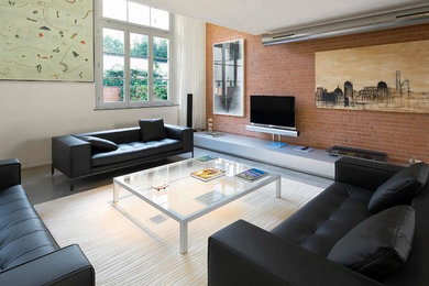 Idee per un soggiorno industriale con pareti bianche e TV a parete