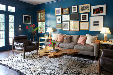Mid-sized transitional dark wood floor family room photo in Los Angeles with blue walls