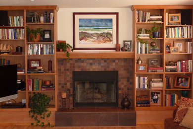 Photo of a small classic open plan games room in Denver with a standard fireplace, a tiled fireplace surround and a wall mounted tv.