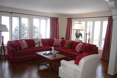 Example of a large farmhouse enclosed medium tone wood floor family room design in Montreal with white walls