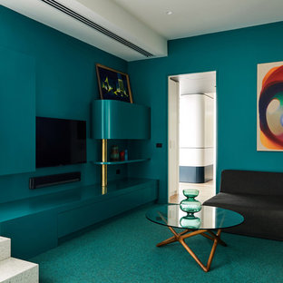 This is an example of a contemporary enclosed family room in Melbourne with green walls, carpet, no fireplace, a wall-mounted tv and green floor.