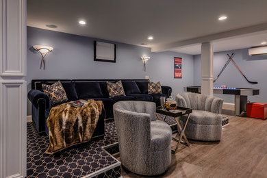 Large transitional open concept vinyl floor game room photo in New York with gray walls, no fireplace and a wall-mounted tv