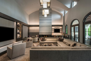 Example of a huge trendy family room design in Dallas with a ribbon fireplace and a media wall