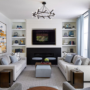 Example of a mid-sized transitional enclosed carpeted and gray floor family room library design in San Francisco with white walls, a metal fireplace, a media wall and a ribbon fireplace