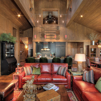 Example of a mountain style open concept family room design in Phoenix with brown walls