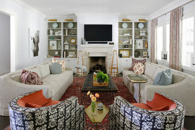 Example of an eclectic enclosed dark wood floor family room design in Nashville with white walls and a wall-mounted tv