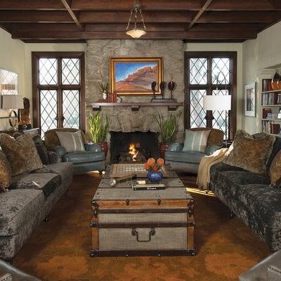 Mid-sized elegant enclosed light wood floor family room photo in Other with white walls, a standard fireplace, a stone fireplace and no tv