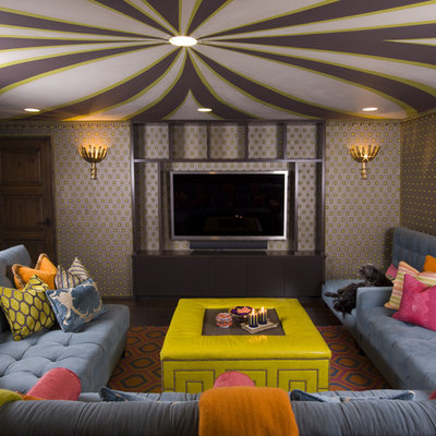 Example of an eclectic enclosed family room design in Los Angeles with a wall-mounted tv and multicolored walls