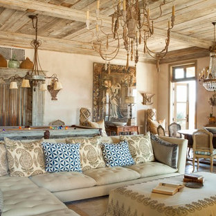 Tuscan family room photo in Los Angeles with beige walls