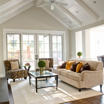 Elegant open concept dark wood floor family room photo in San Francisco with beige walls