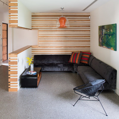 Example of a small trendy open concept concrete floor family room design in Melbourne with white walls, no fireplace and no tv