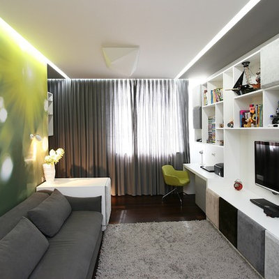 Inspiration for a contemporary enclosed family room remodel in Other with green walls and a wall-mounted tv