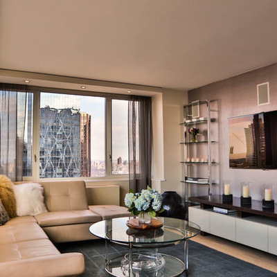 Mid-sized trendy open concept light wood floor family room photo in New York with a wall-mounted tv and multicolored walls