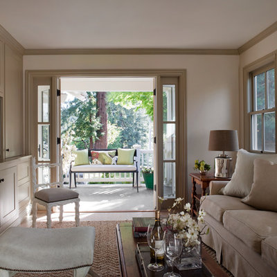 Family room - traditional enclosed family room idea in San Francisco with beige walls, no fireplace and a media wall