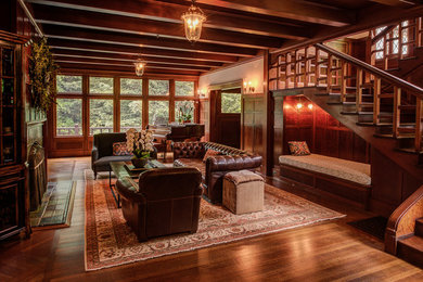 Family room - mid-sized victorian enclosed dark wood floor and brown floor family room idea in San Francisco with a music area, beige walls, a standard fireplace, a tile fireplace and no tv