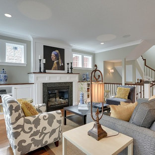 Example of a large transitional open concept medium tone wood floor family room design in Minneapolis with gray walls, a standard fireplace, a stone fireplace and no tv