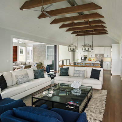 Inspiration for a large coastal open concept medium tone wood floor family room remodel in Other with gray walls, a stone fireplace, a wall-mounted tv and a ribbon fireplace