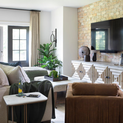 Example of a large farmhouse open concept light wood floor and beige floor family room design in Atlanta with white walls, no fireplace and a wall-mounted tv