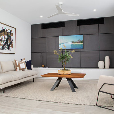 Small trendy open concept porcelain tile and gray floor family room photo in Gold Coast - Tweed with a wall-mounted tv and white walls
