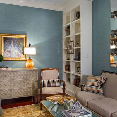 Example of a classic enclosed family room design in Charlotte with blue walls