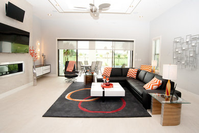 Family room - modern family room idea in Orlando with a standard fireplace and a tile fireplace