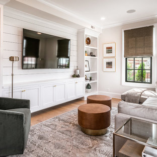 Inspiration for a transitional light wood floor family room library remodel in Louisville with gray walls, no fireplace and a media wall