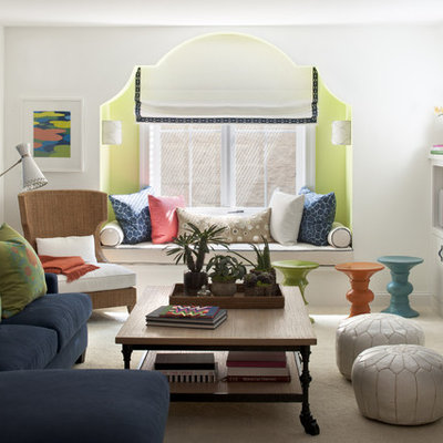 Eclectic carpeted and beige floor family room photo in Minneapolis with white walls, a standard fireplace and a wall-mounted tv