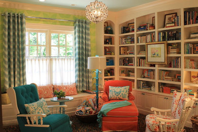 Mid-sized elegant enclosed medium tone wood floor family room library photo in Atlanta with green walls and no tv