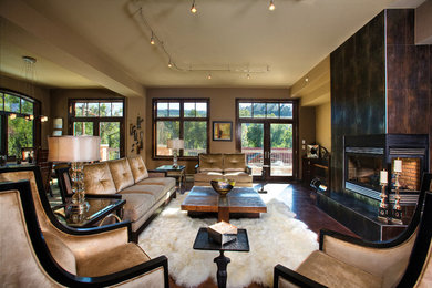 Inspiration for a contemporary dark wood floor living room remodel in Denver with a metal fireplace