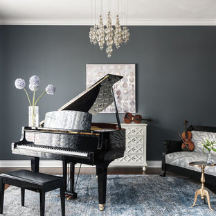 Family room - mid-sized transitional enclosed brown floor and dark wood floor family room idea in St Louis with a music area, gray walls and no fireplace