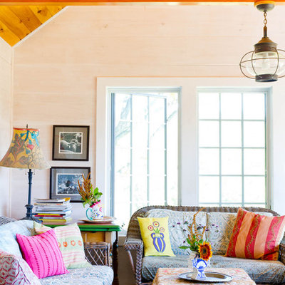 Example of a farmhouse family room design in New York with beige walls