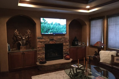 Example of an arts and crafts family room design in Denver
