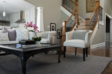 Inspiration for a mid-sized transitional open concept dark wood floor family room remodel in Indianapolis with beige walls, no fireplace and no tv