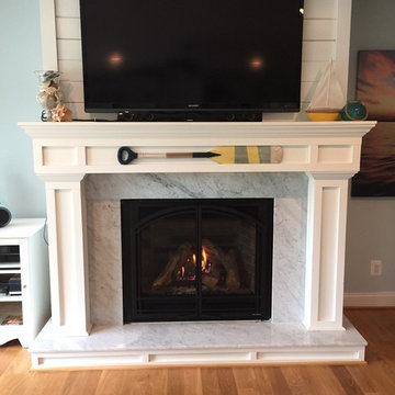 New gas fireplace with cottage design and marble surround